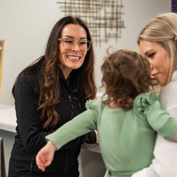 McClaran Orthodontics - Dr. McClaran welcoming a family to the practice