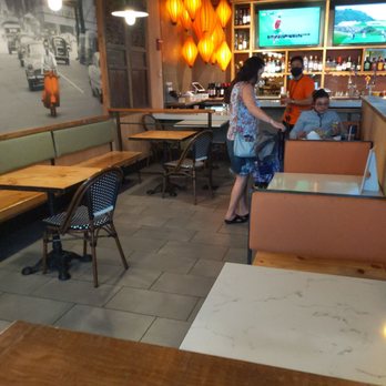 Bambuza Vietnam Kitchen and Bar - Empty tables reserved for booze drinkers. They expect you to eat on the floor in the terminal unless you buy a cheap glass of wine for $15. - Vietnamese Near Me - Seattle, Washington Bambuza Vietnam Kitchen and Bar - Empty tables reserved for booze drinkers. They expect you to eat on the floor in the terminal unless you buy a cheap glass of wine for $15. - Vietnamese Near Me - Seattle, Washington