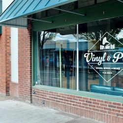 Vinyl and Pine - Exterior window with logo.