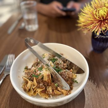 Via Triozzi - a plate of pasta with meat and cheese - Italian Near Me - Dallas, Texas Via Triozzi - a plate of pasta with meat and cheese - Italian Near Me - Dallas, Texas