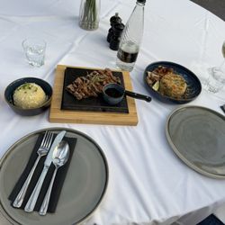 Umami - Sirloin steak served on a hot stone plate, egg fried rice. Chicken fried rice.   Camden pale ale and a glass Pinot noir