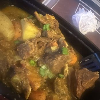 Irie Eats - Curry goat - Caribbean Near Me - St. Louis, Missouri Irie Eats - Curry goat - Caribbean Near Me - St. Louis, Missouri