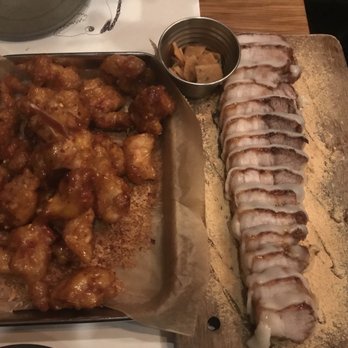Take31 - Garlic chicken and rice cake wrapped pork belly. Both were very good - Korean Near Me - New York, New York Take31 - Garlic chicken and rice cake wrapped pork belly. Both were very good - Korean Near Me - New York, New York