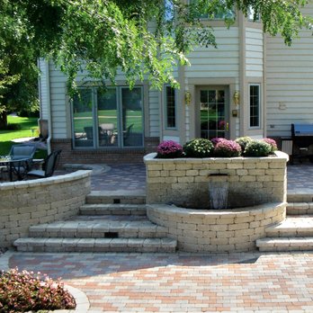 Tyler's Landscaping - a patio with a fountain - Landscaping Near Me - Rockford, Illinois Tyler's Landscaping - a patio with a fountain - Landscaping Near Me - Rockford, Illinois
