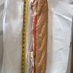 Italian hoagie comes with prosciutto, sharp provolone, and tomato.