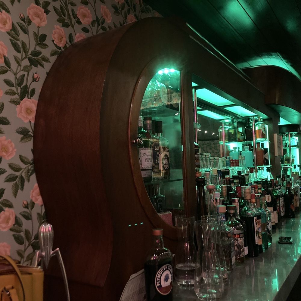 Time Will Tell - a bar with a large mirror - Cocktail Bars Near Me - Detroit, Michigan Time Will Tell - a bar with a large mirror - Cocktail Bars Near Me - Detroit, Michigan