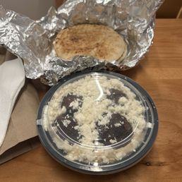 Hummus and Falafel plate, add feta, with fresh pita in the background. Hummus and Falafel plate, add feta, with fresh pita in the background.