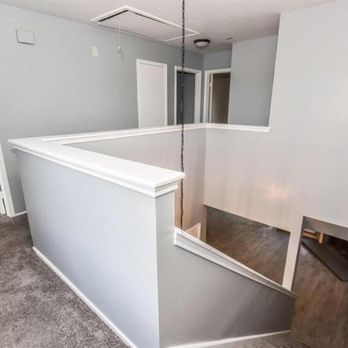 Team Builders Construction, Inc. - a view of a hallway from the second floor - Roofing Near Me - Houston, Texas