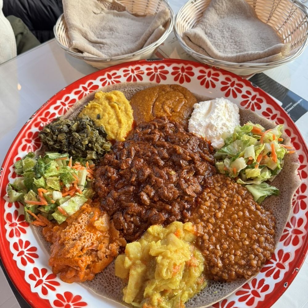 Meskel Ethiopian Restaurant - Vegetable Combo with Yegee Tibbs in the middle - $50 - Ethiopian Near Me - Seattle, Washington Meskel Ethiopian Restaurant - Vegetable Combo with Yegee Tibbs in the middle - $50 - Ethiopian Near Me - Seattle, Washington
