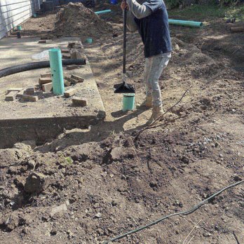 Ware Landscaping & Snow Removal - Tamping down of the backfilled dirt after drain was installed. - Landscaping Near Me - Naperville, Illinois Ware Landscaping & Snow Removal - Tamping down of the backfilled dirt after drain was installed. - Landscaping Near Me - Naperville, Illinois