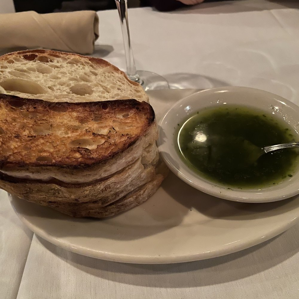 Cafe Tiramisu - Bread and pesto olive oil - Italian Near Me - Raleigh, North Carolina Cafe Tiramisu - Bread and pesto olive oil - Italian Near Me - Raleigh, North Carolina