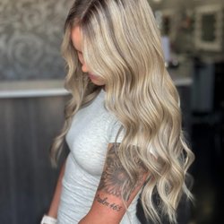 Studio 7 - Dimensional blonde highlights created for a soft grow out in a loam maintenance color.