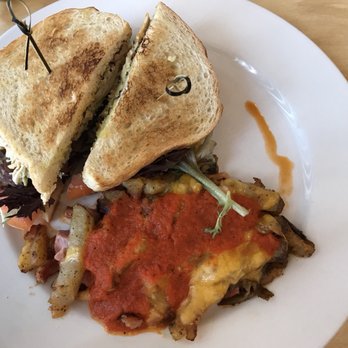 Mimosa - This was the chicken sandwich with bacon, avocado, and cheese. With the Mimosa potatoes with ham, cheddar, and red roasted pepper sauce. - Breakfast & Brunch Near Me - Franklin, Wisconsin