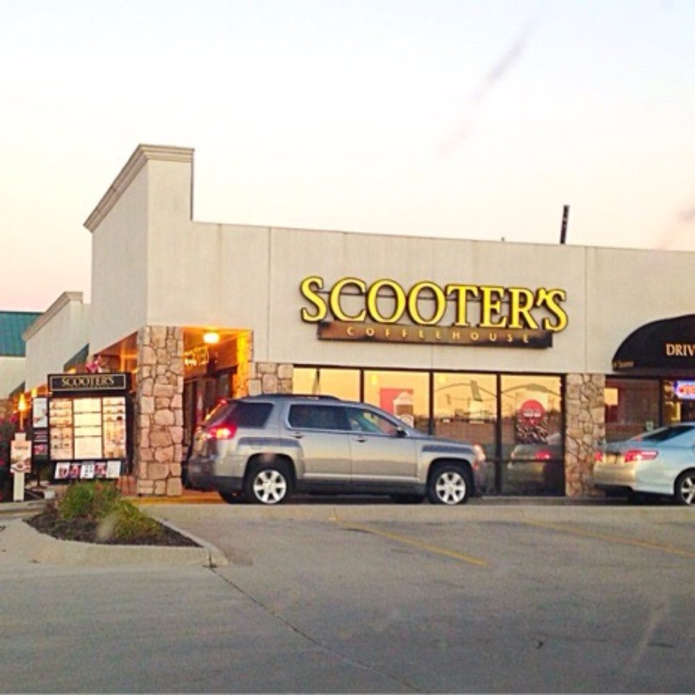 two cars parked in front of the store