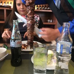 Fogón do Brasil - The waiters serve the meat in spades