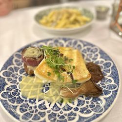 Market fish entree: Halibut, served over lemon thyme butter with oyster mushrooms, caramelized shallot, and fried polenta
