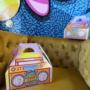 Yo Mochi - Seating area with mochi donut boxes - Donuts Near Me - Henderson, Nevada Yo Mochi - Seating area with mochi donut boxes - Donuts Near Me - Henderson, Nevada