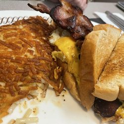 Waffle House - Bacon Egg and Cheese Sandwich. Regular Hashbrowns