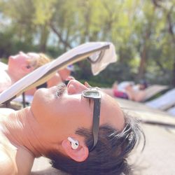 Lynden Travel Company - Enjoying the Mirage's large swimming pool on a very warm 80 degrees heat and sun getting that tan.