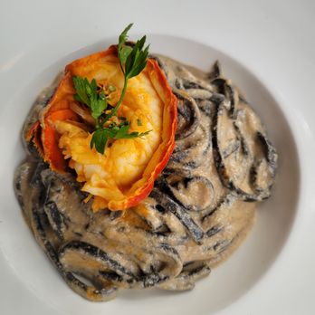 Bricco - Squid in pasta in cream sauce with a lovely lobster tail as lagniappe - PERFECTION ON A PLATE - Italian Near Me - Boston, Massachusetts