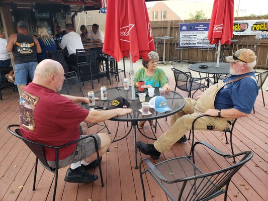 Photo of Louies Sports Pub - Fayetteville, NC, US. Rabbit, Barbara and Jed outside.