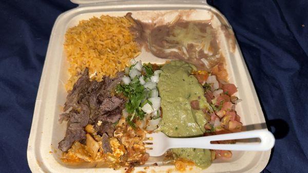 Photo of Chavez Supermarket & Taqueria - Hayward, CA, US. Perfect chilaquiles rojos and freshly grilled carne asada. Only wish I got more rice and meat they are so good.