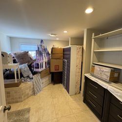 Montvale Moving - The bathroom (see tub) where everything was piled on and barricaded closed improperly stored.