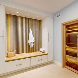 Mayflower Kitchen and Bath - Custom cedar sauna suite in McLean, VA. Harvia heater, LED bench lighting, WiFi controls, glass door. Mayflower Kitchen and Bath.