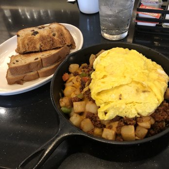 The Jagged Fork - Chorizo skillet with scrambled eggs and cinnamon raisin toast - Breakfast & Brunch Near Me - Ann Arbor, Michigan