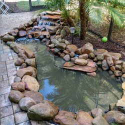 Wonders of Water - Pool Deck Pond with a waterfall feature.