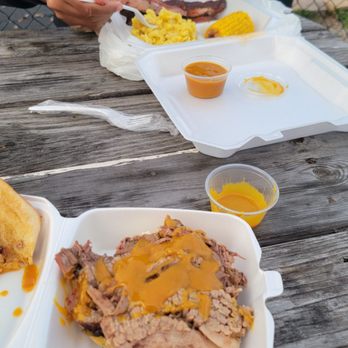 Sims Smoked Barbecue & Seafood - Brisket sandwich and ribs with corn and Mac and cheese - Barbeque Near Me - Seffner, Florida Sims Smoked Barbecue & Seafood - Brisket sandwich and ribs with corn and Mac and cheese - Barbeque Near Me - Seffner, Florida