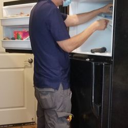 Appliance Service Pros - Checking the fan.