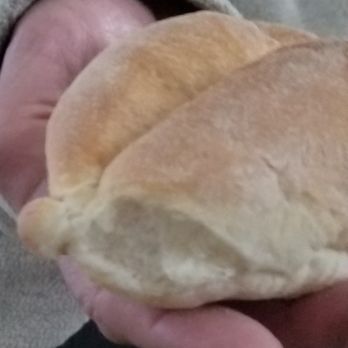 Cunha Bakery - a person holding a sandwich - Bakeries Near Me - Fall River, Massachusetts