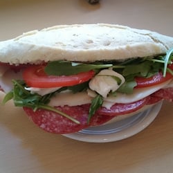The Norfolk Street Deli - Spanish white bread with salami, provolone cheese, mozzarella, rocket and tomatoes.