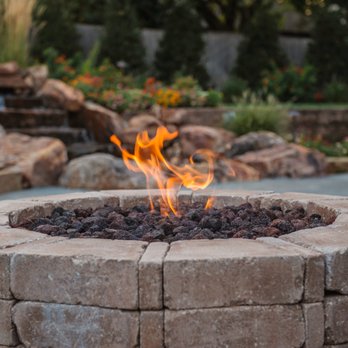 Nelson Landscaping - a fire pit surrounded by rocks - Landscaping Near Me - Oklahoma City, Oklahoma Nelson Landscaping - a fire pit surrounded by rocks - Landscaping Near Me - Oklahoma City, Oklahoma