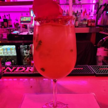 The Dunes Cocoa Beach - a pink cocktail with a pineapple garnish - Lounges Near Me - Cocoa Beach, Florida The Dunes Cocoa Beach - a pink cocktail with a pineapple garnish - Lounges Near Me - Cocoa Beach, Florida