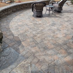 Unique Landscapes - Paver patio with seating wall.