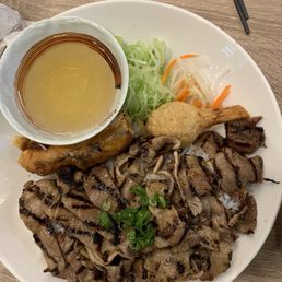 Grilled pork, spring rolls and shrimp on sugarcane with Vermicelli Grilled pork, spring rolls and shrimp on sugarcane with Vermicelli