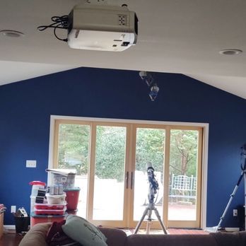 Millennium Home Renovations - a living room with blue walls - General Contractors Near Me - Springfield, Virginia