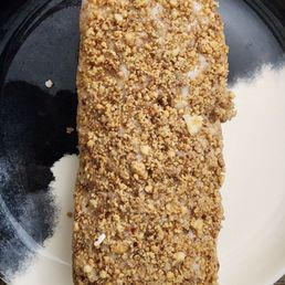 Donut coated with peanut crumbs