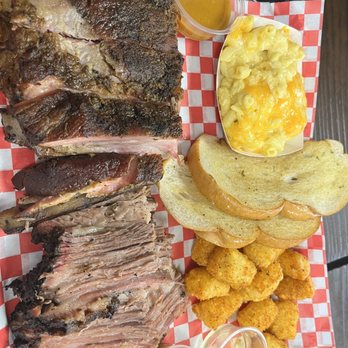 Uncle Tony's Backyard Bbq - Sample platter.  St. Louis ribs  Brisket (sliced)  Tater tots  Garlic bread  Mac and cheese - Barbeque Near Me - Orlando, Florida