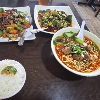 Sichuan Kitchen - Left to right: beef stir fry, cucumber spicy salad, and beef noodles - Chinese Near Me - Jacksonville, Florida Sichuan Kitchen - Left to right: beef stir fry, cucumber spicy salad, and beef noodles - Chinese Near Me - Jacksonville, Florida