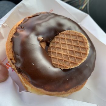 Dunkin' Donuts - hand holding a chocolate covered donut - Coffee & Tea Near Me - Cherry Hill, New Jersey Dunkin' Donuts - hand holding a chocolate covered donut - Coffee & Tea Near Me - Cherry Hill, New Jersey