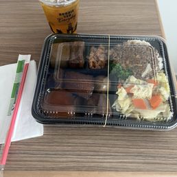 Bento Box with stewed pork and green tea. Bento Box with stewed pork and green tea.
