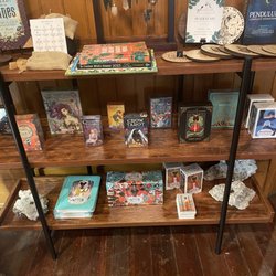 Bespell & Co - Variety of tarot cards, runes, and pendulums.