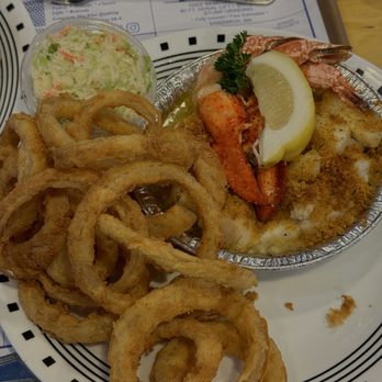 Seafood Sam's - Baked scallops, white fish, shrimp, and some lobster. A side of onion rings and cole slaw. - Seafood Near Me - Sandwich, Massachusetts