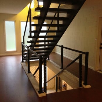 Durend Construction LLC - Sapa railing with stainless steel wire railing. Western cork floor and trim. Common breezeway in St. John's 4 plex. - General Contractors Near Me Durend Construction LLC - Sapa railing with stainless steel wire railing. Western cork floor and trim. Common breezeway in St. John's 4 plex. - General Contractors Near Me