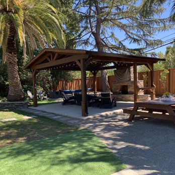 Ml Construction - a picnic area with a grill and picnic table - General Contractors Near Me