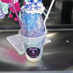STARFIGHTER GALAXY: Blue raspberry & grape shaved ice stuffed w/vanilla ice cream and rock candy from snoglow