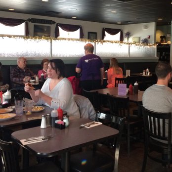 South Street Diner - Large open dining room with black ceiling tiles and chairs, make for a dark room. - Diners Near Me - Westborough, Massachusetts